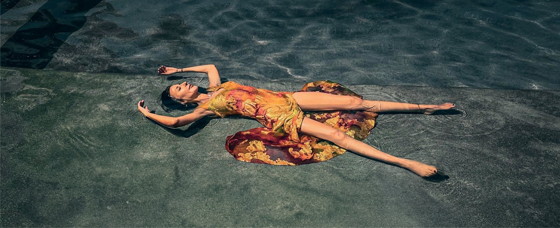 preema wearing las galeras dress in pool