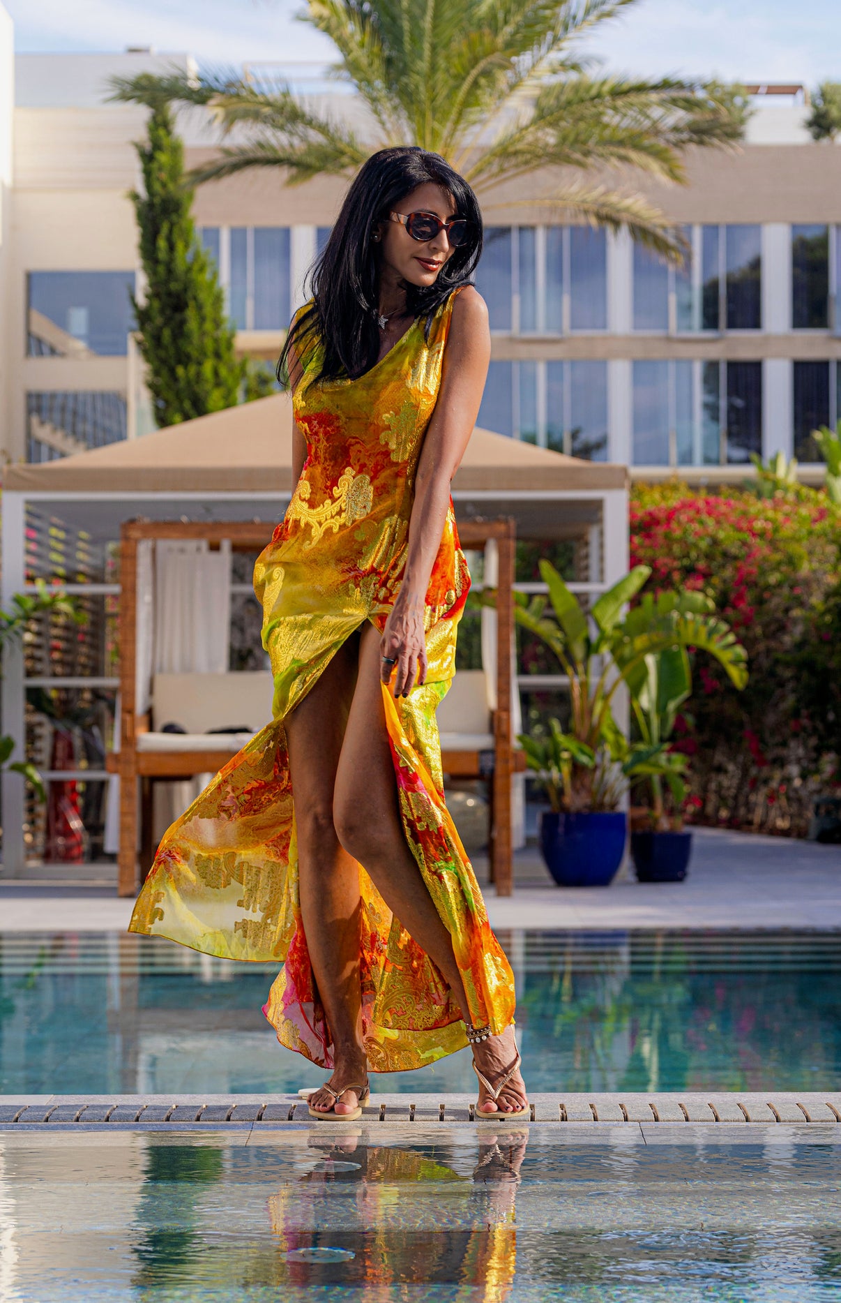 Model posing in the Mystique Horizons dress by Preema Aura, surrounded by natural textures and soft light.