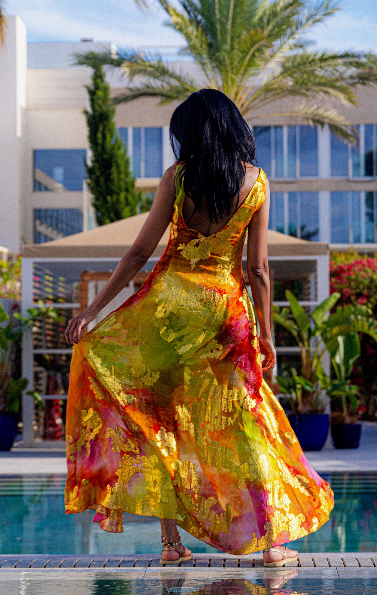Back view of the Mystique Horizons dress in motion, in the summer sun.