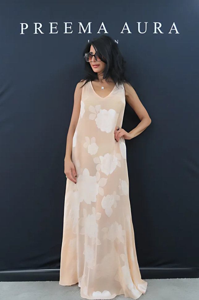 Model wearing Preema Aura Soul Series Bloom dress – floor-length blush silk gown with subtle sheen and delicate white floral pattern
