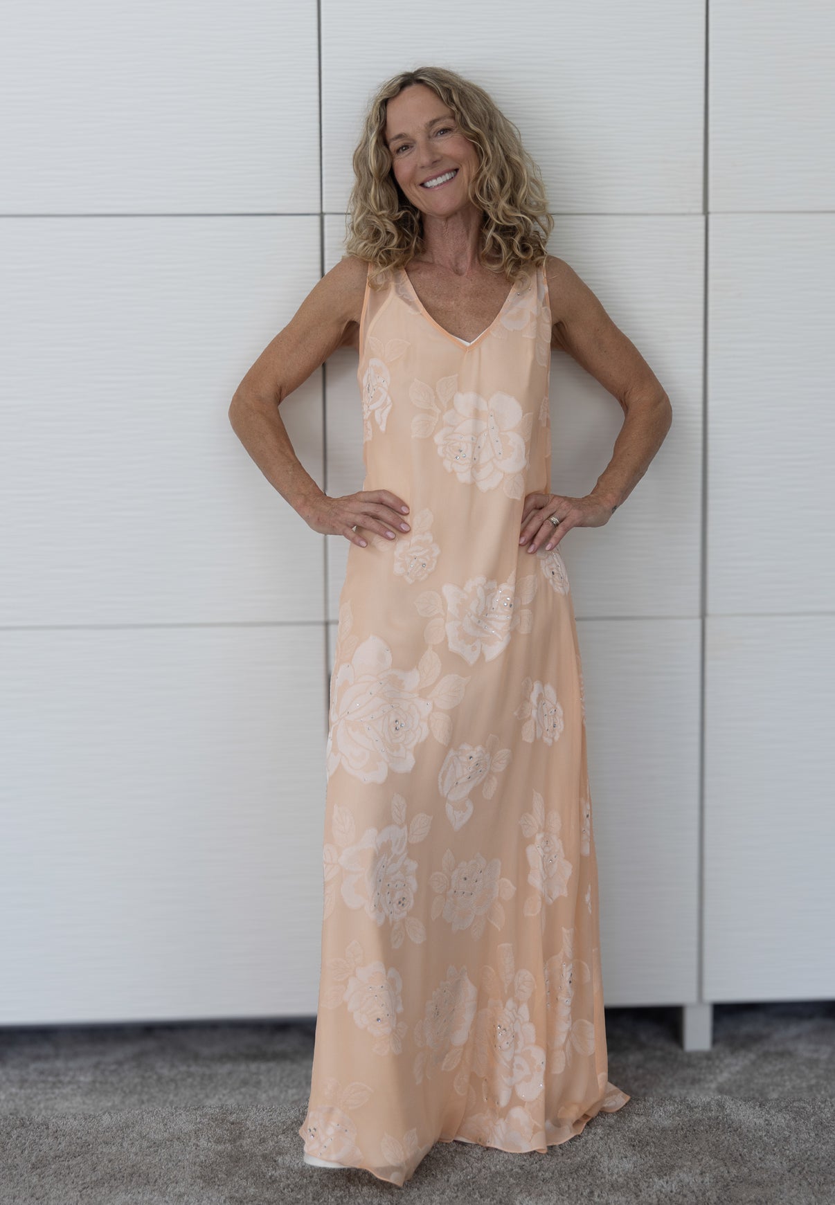Soul Bloom by Preema Aura styled with a cream satin slip, showing the full-length silhouette and delicate peach floral design.