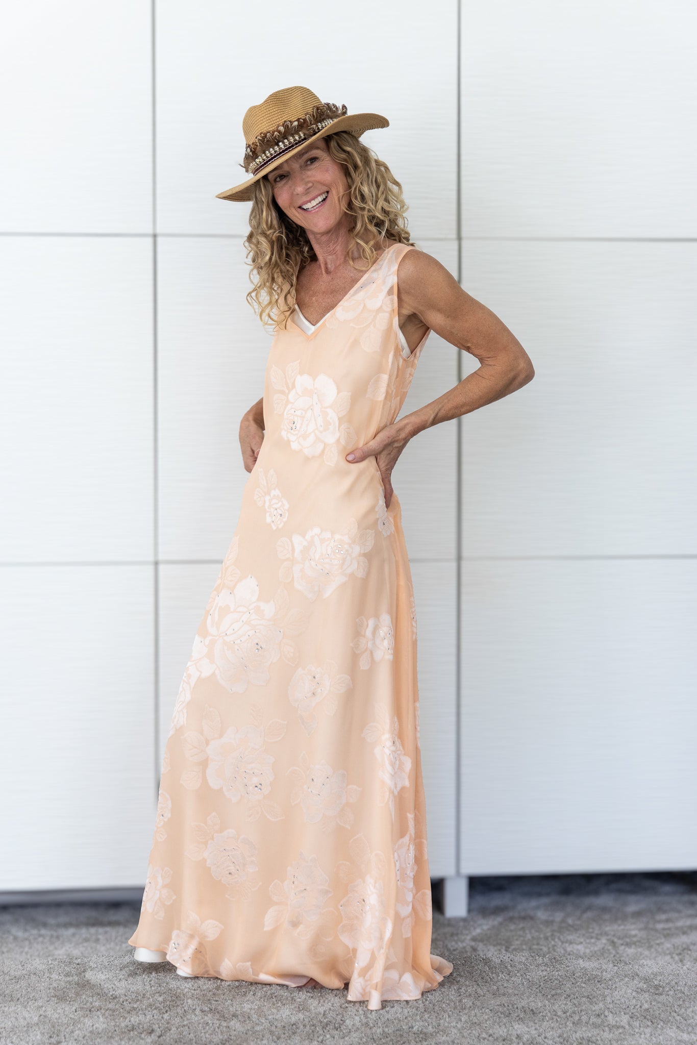 Soul Bloom by Preema Aura layered over a cream slip, featuring the flowing peach fabric and embroidered floral motifs.