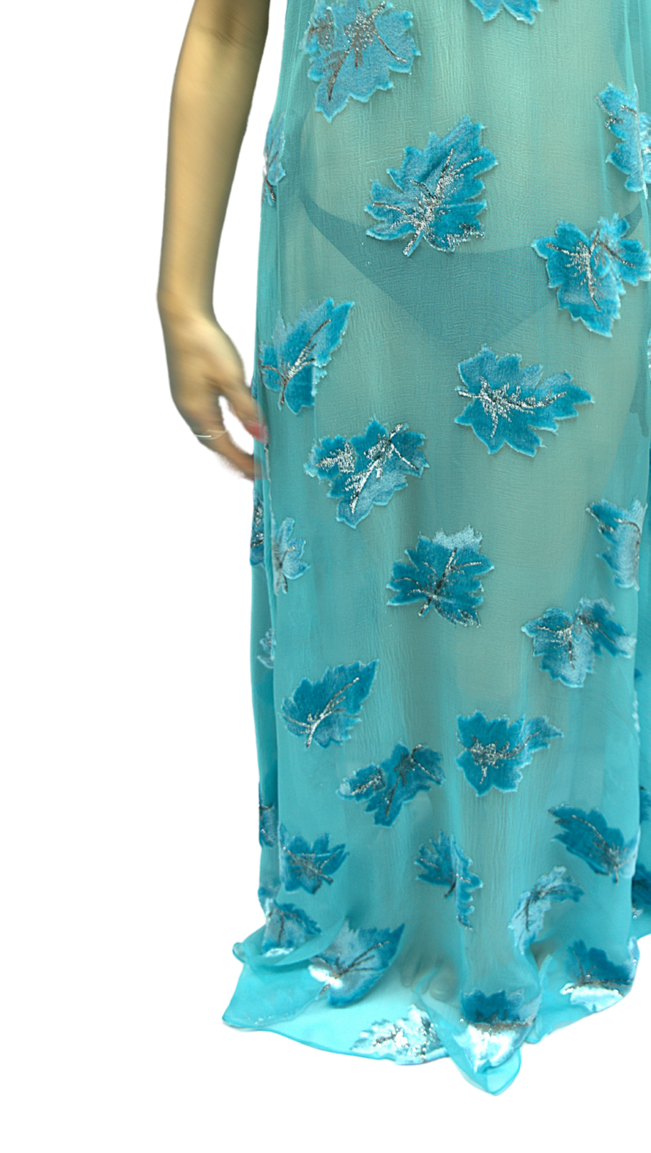 A close-up of a model wearing the Soul Cascade dress from Preema Aura's Soul Series – a flowing, floor-length gown designed for effortless elegance, crafted in lightweight fabric for luxury resort wear and timeless occasion dressing.