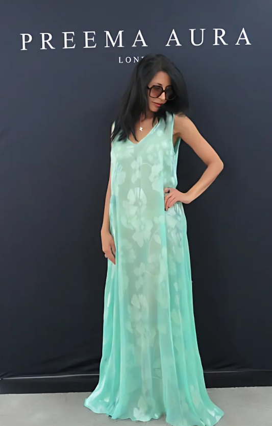 Front view of model in floor-length Soul Eden dress by Preema Aura, crafted in airy mint green silk with soft floral detailing.