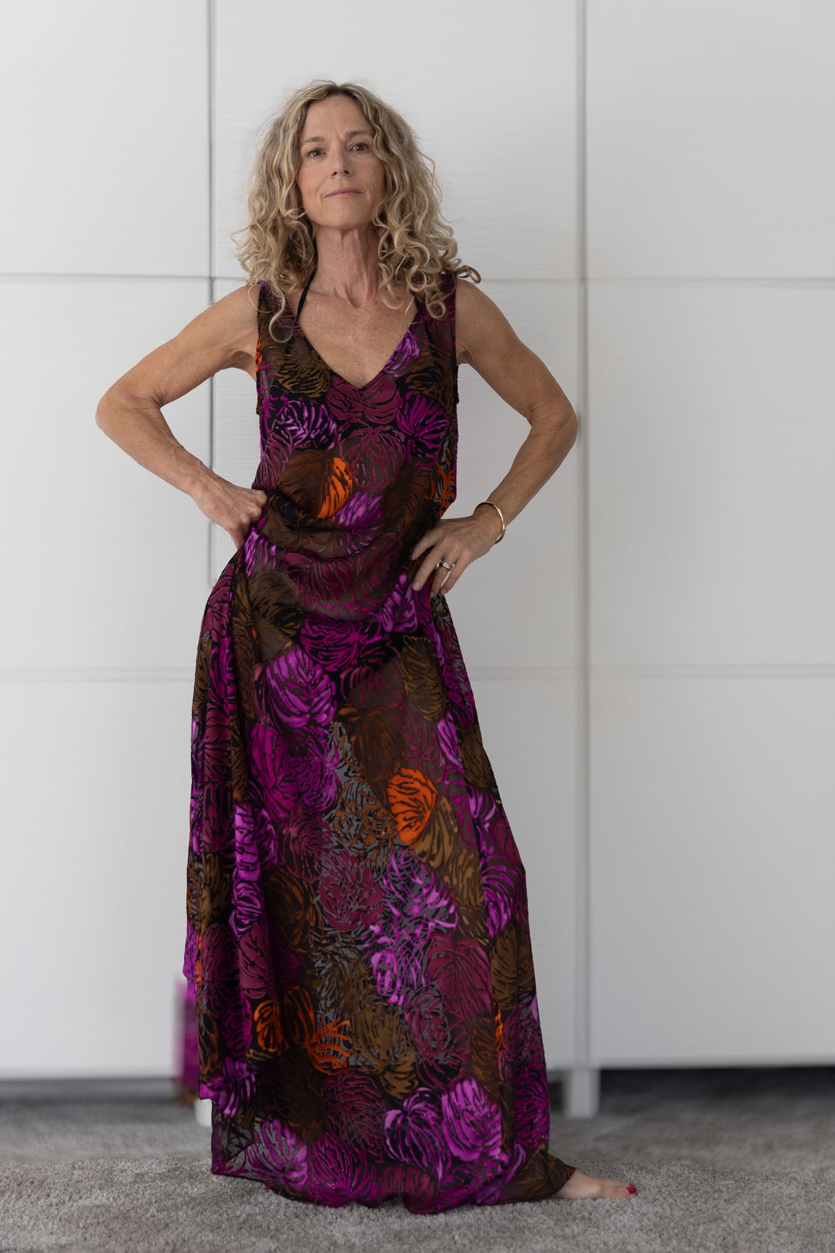 Soul Flame by Preema Aura – vibrant sheer maxi dress in deep magenta, orange and chocolate hues, styled over a bikini for effortless resort elegance.