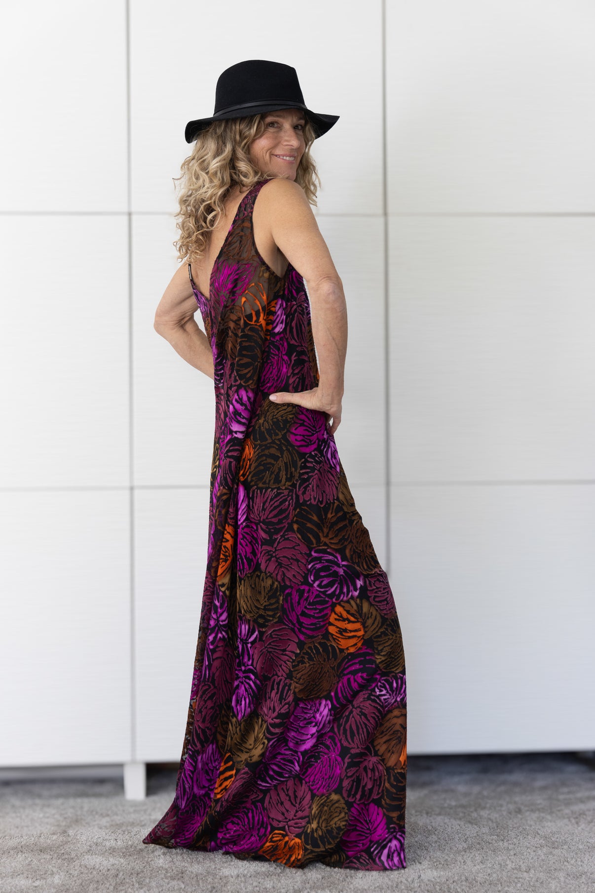 Soul Flame by Preema Aura – rich patterned silk-blend dress layered over a black slip, transforming from beach to evening with fluid movement and bold colour.