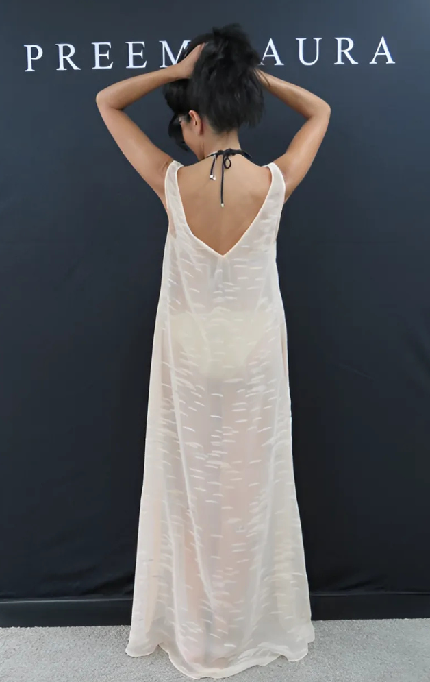 Back view of Soul Flare dress by Preema Aura, revealing elegant low-cut back and fluid silhouette