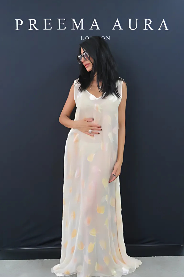 Model wearing Preema Aura’s Soul Glimmer silk dress with iridescent tulip motif, sheer ivory base and shimmering pastel hues – front view