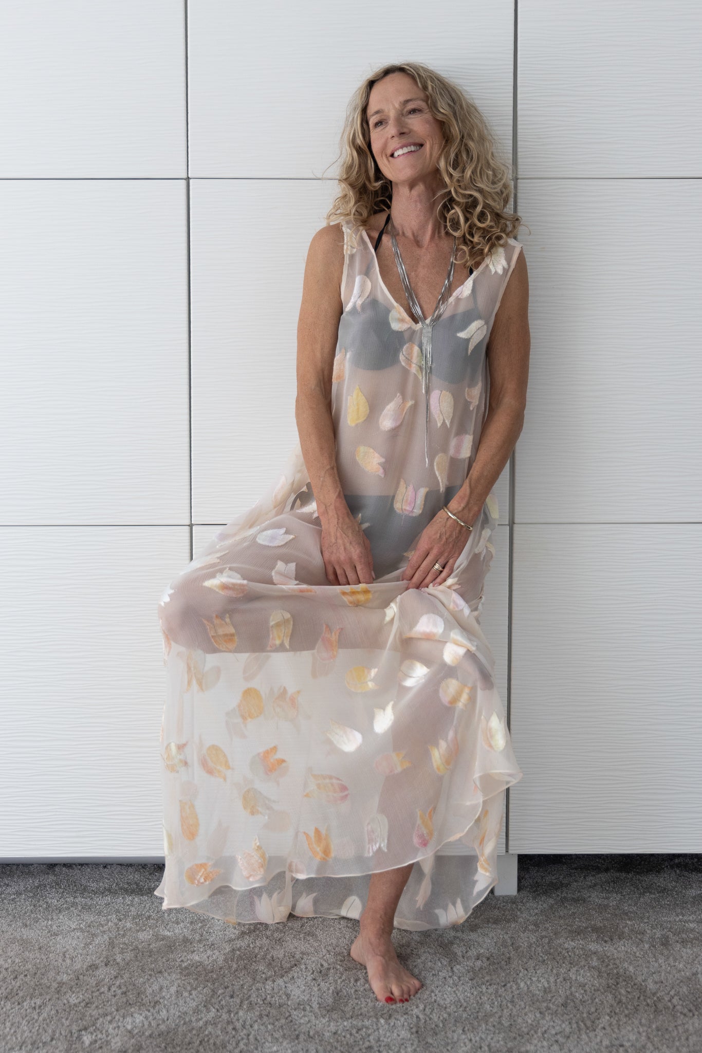 Soul Glimmer by Preema Aura — a soft, ethereal sheer maxi dress with delicate pastel petal accents, photographed to emphasise its airy texture and effortlessly elegant fit.