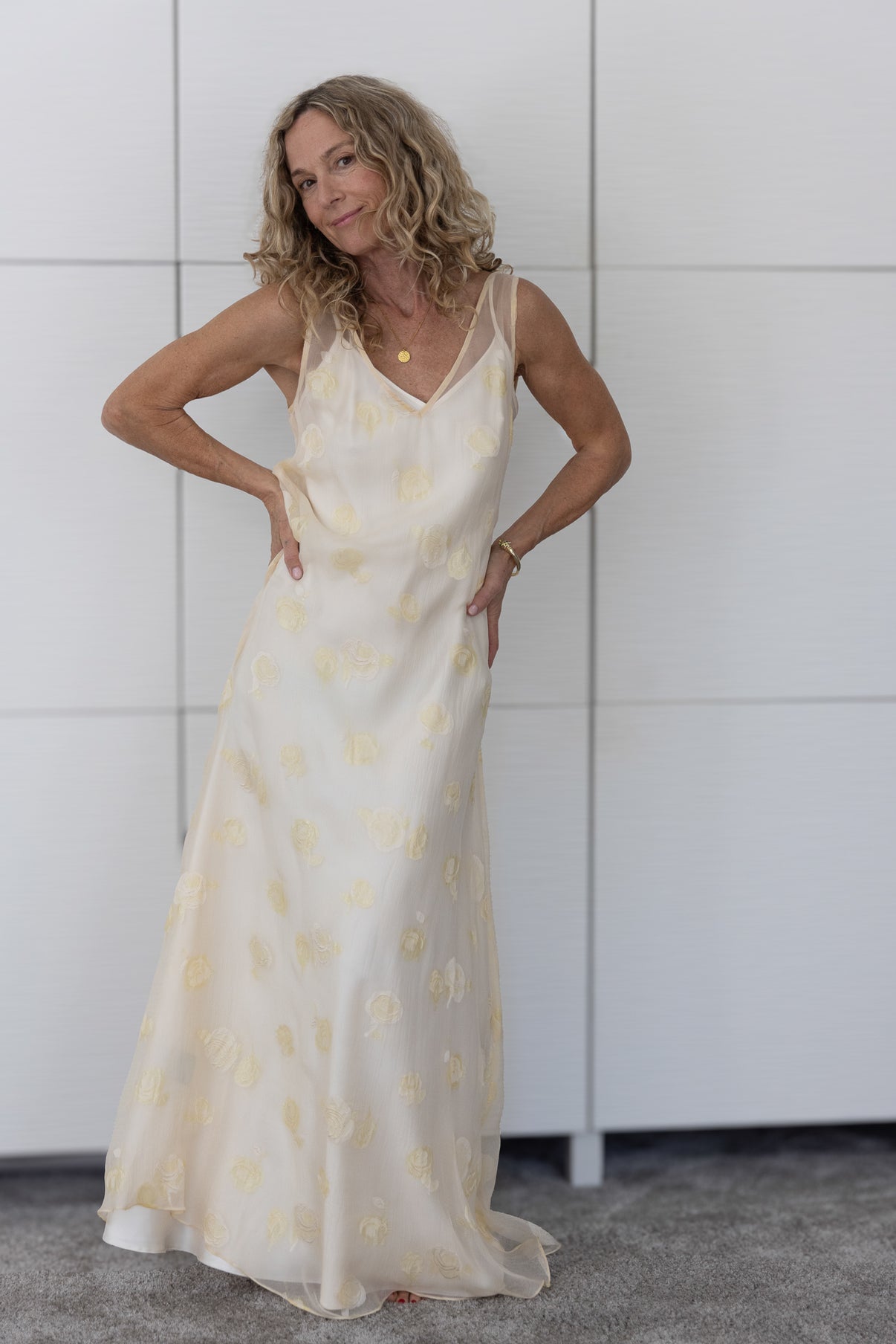 Soul Lune by Preema Aura worn over a cream slip — a soft, flowing sheer maxi dress with delicate yellow rose motifs, captured in natural light to showcase its elegant movement and feminine silhouette.