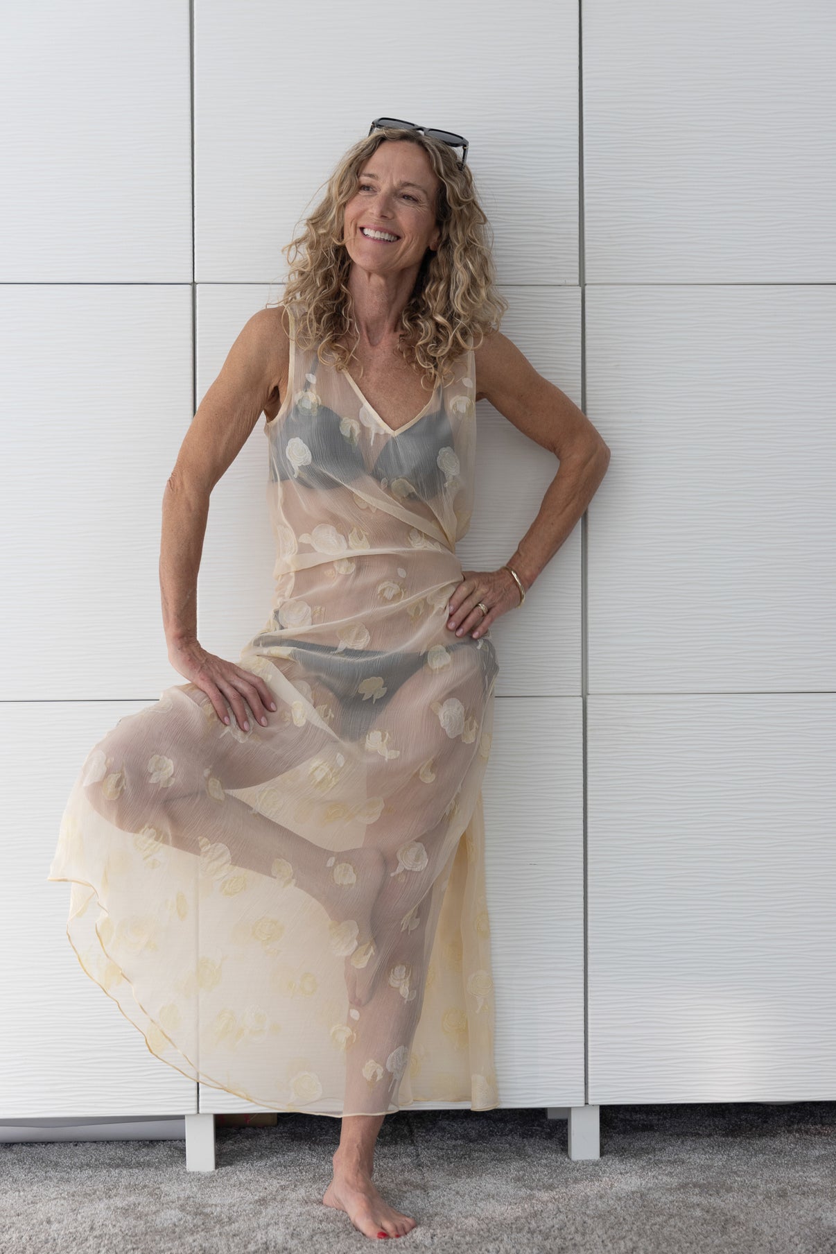 Soul Lune by Preema Aura styled over a bikini — a sheer, lightweight maxi dress with subtle yellow rose detailing, photographed to highlight its translucent texture and effortless resort-ready drape