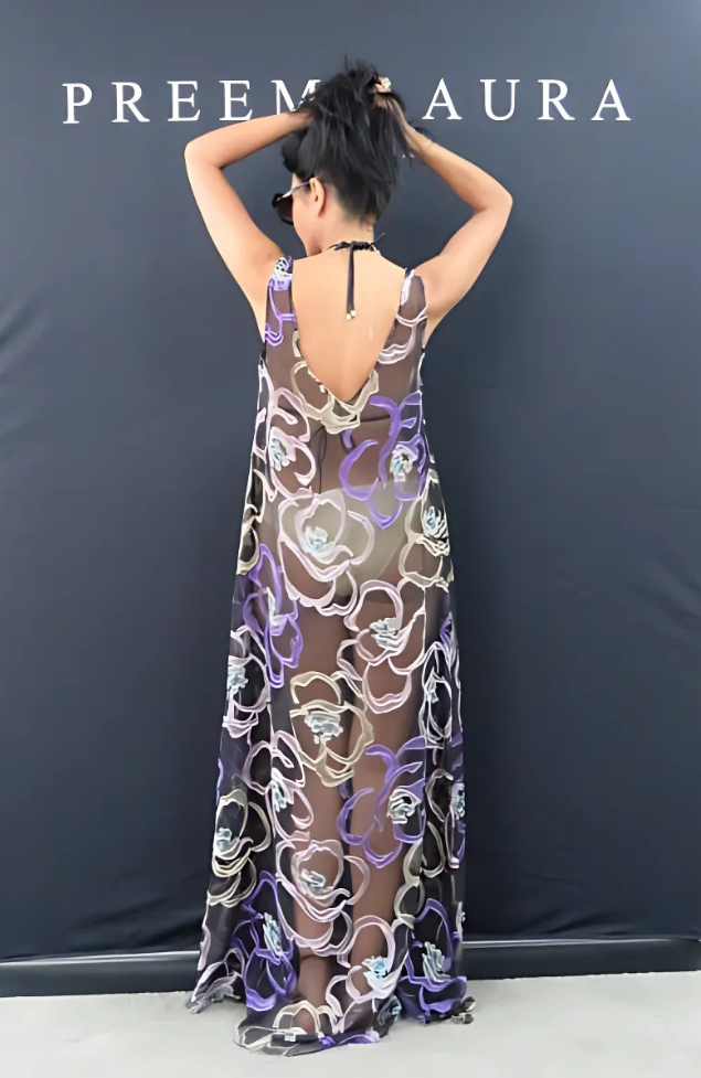 Back view of Preema Aura Soul Series Mirage dress – flowing transparent silk maxi with sculptural floral print in pastel tones on a smoky black base