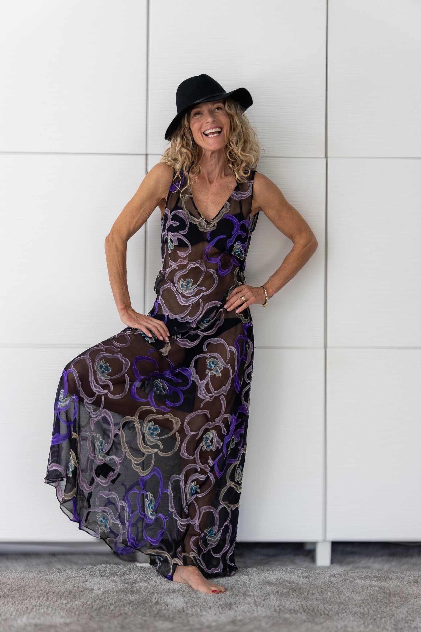 Soul Mirage by Preema Aura – sheer black maxi dress with hand-embroidered floral motifs in violet, taupe and teal, celebrating individuality and confident expression.