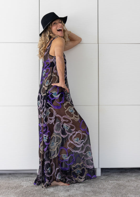 Soul Mirage by Preema Aura – sheer black floral-embroidered maxi dress styled over a bikini, exuding relaxed elegance and effortless resort allure.