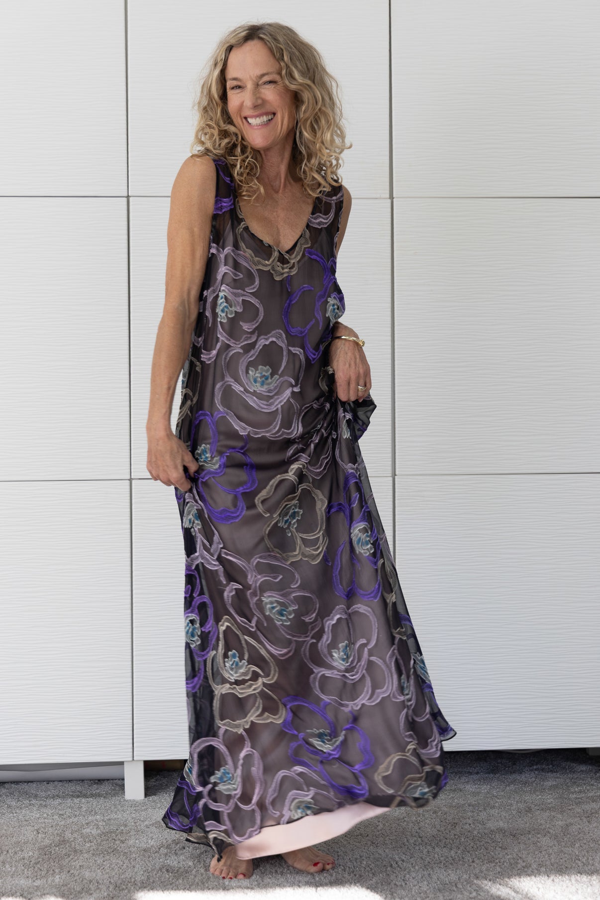 Soul Mirage by Preema Aura – sheer floral overlay worn over a blush satin slip, revealing soft movement and a romantic interplay of dark and pastel hues.