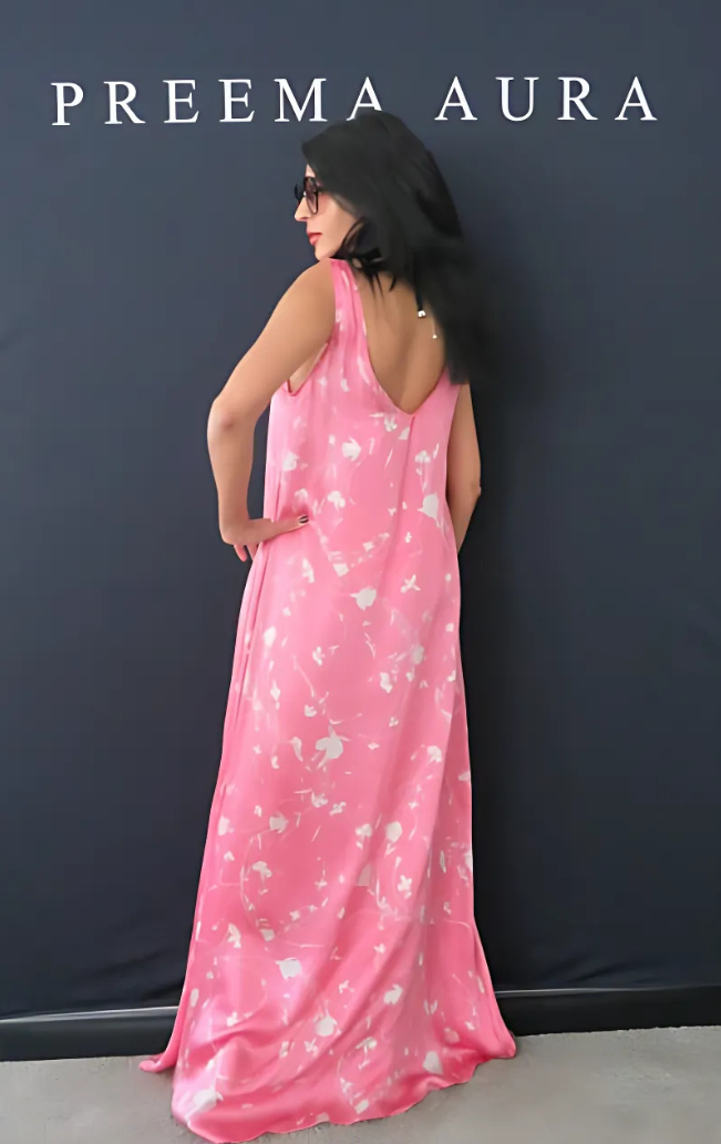 Back view of model wearing Preema Aura Soul Series Petal dress – floor-length silk pink gown with ivory abstract floral print and elegant drape