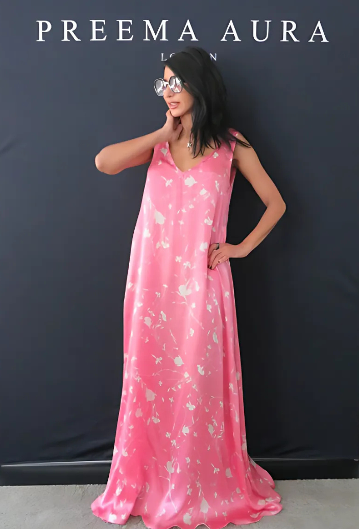 Model wearing Preema Aura Soul Series Petal dress – flowing silk maxi dress in vibrant pink with soft ivory floral design and subtle sheen