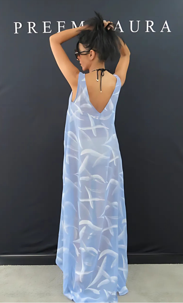 Back view of Preema Aura Soul Soar silk dress in soft blue, featuring a plunging backline and elegant feather-like detailing – perfect for summer styling.