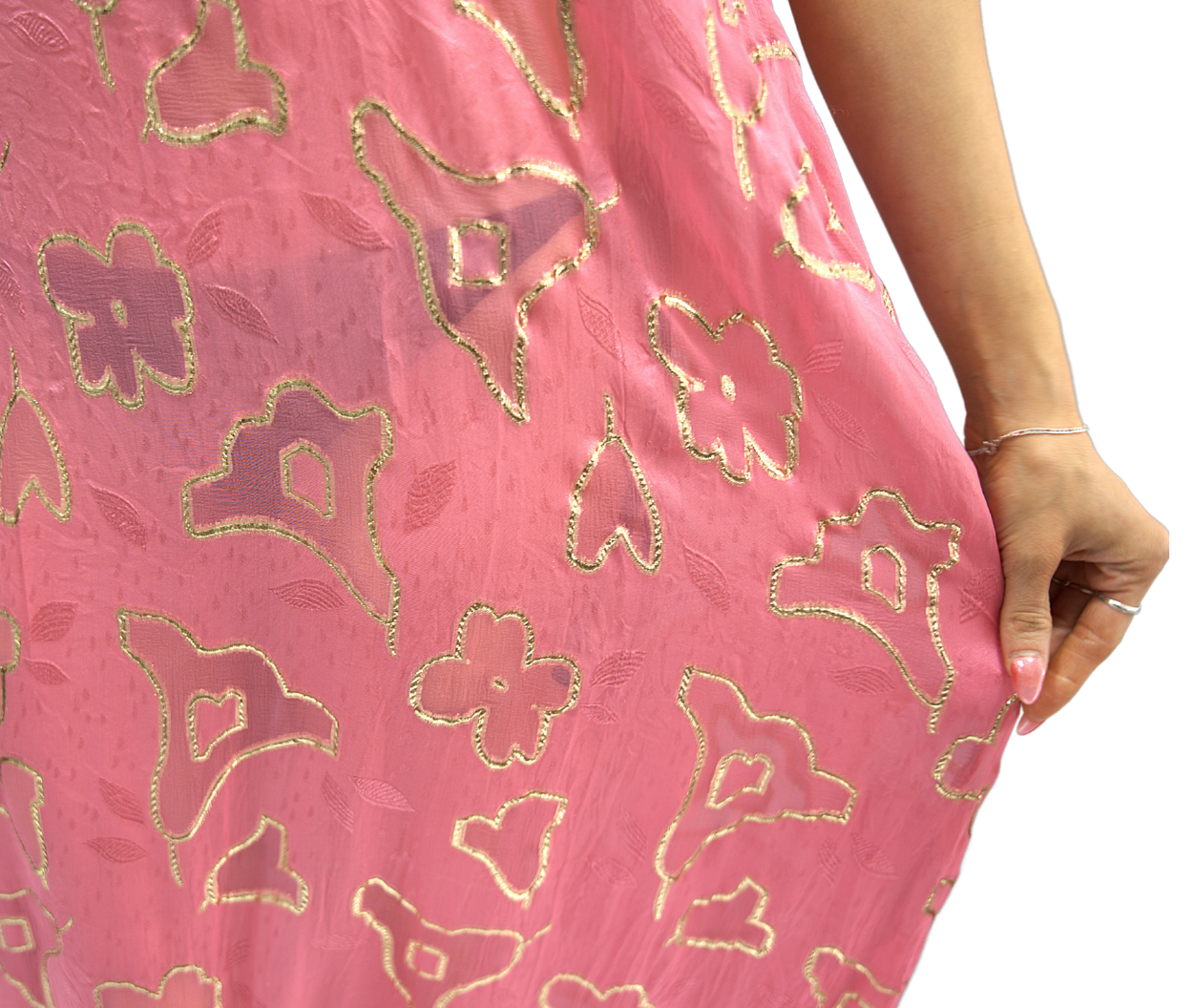 A close-up of a model wearing the Soul Spark dress from Preema Aura's Soul Series – a flowing, floor-length gown designed for effortless elegance, crafted in lightweight fabric for luxury resort wear and timeless occasion dressing.