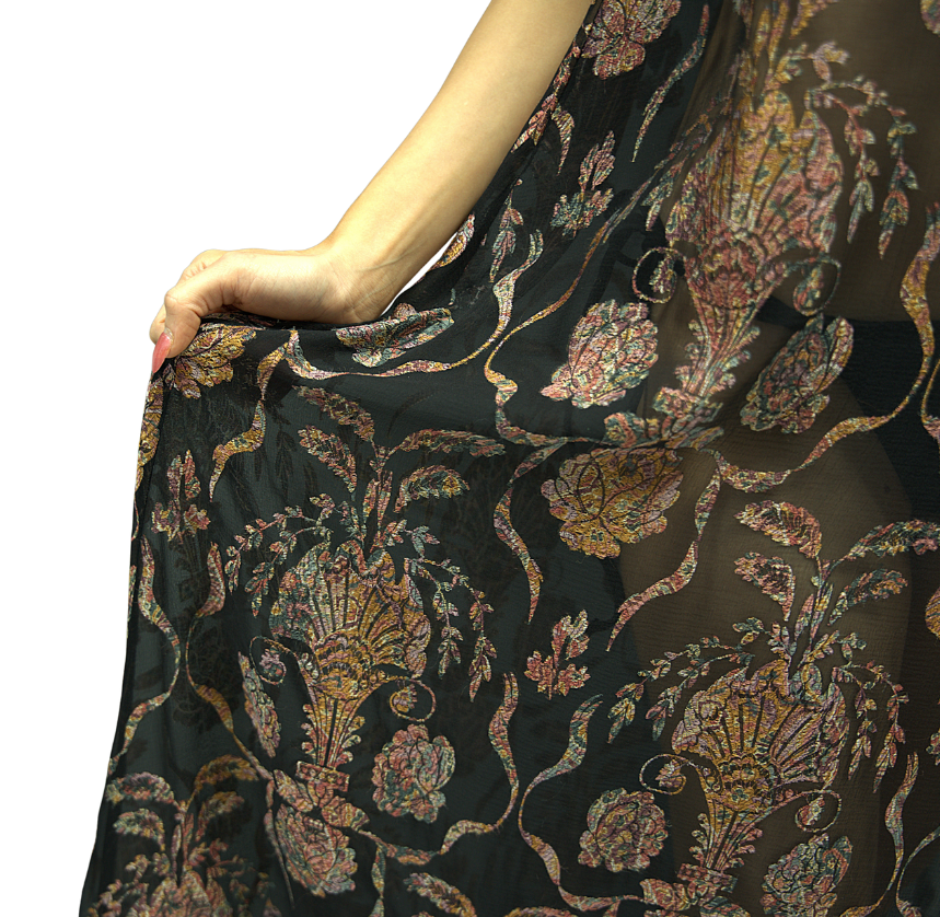 Detailed close-up of Soul Sway fabric – black silk with intricate gold and pink jacquard embroidery