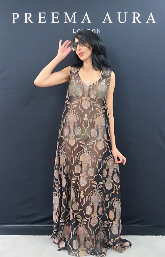 "Model wearing the Preema Aura Soul Sway dress in black silk with soft pink and gold tapestry-style floral embroidery – front view"