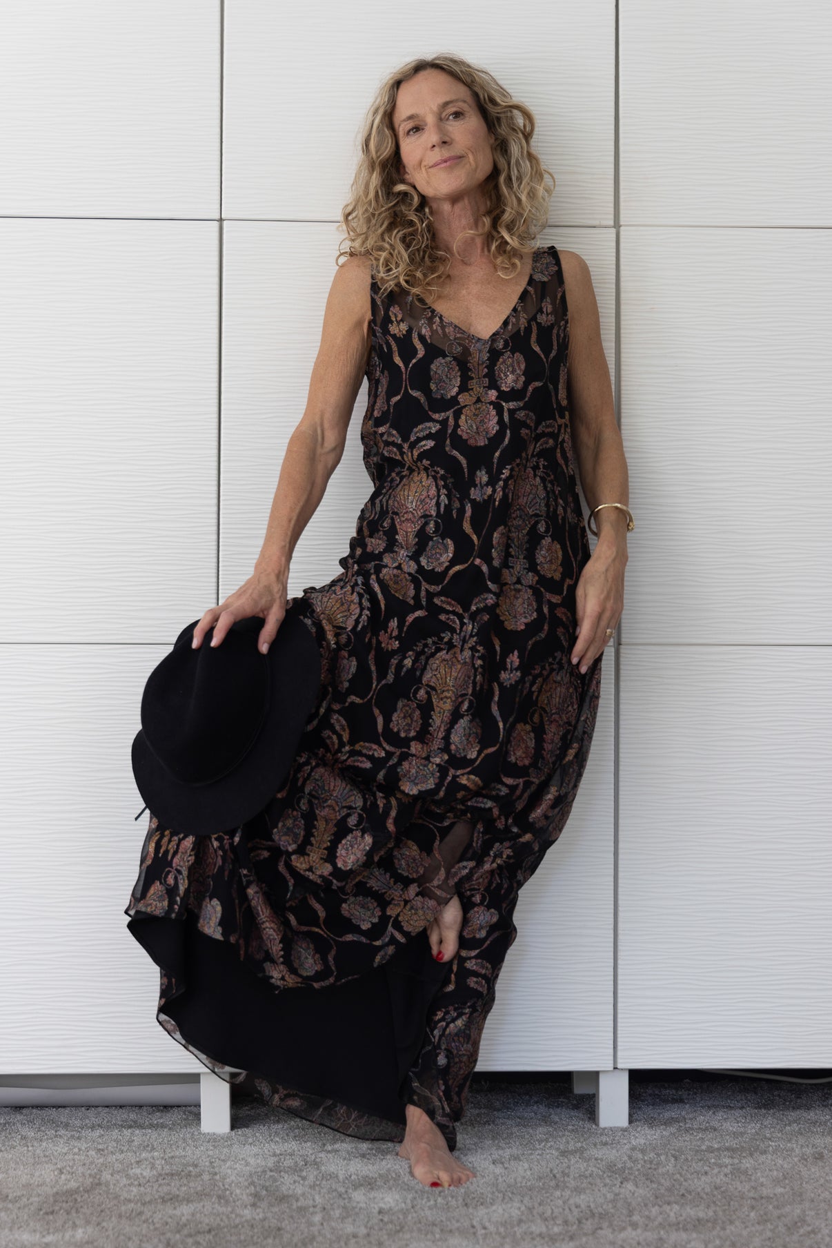 Close-up of Soul Sway sheer black silk A-line slip dress over a black satin slip, highlighting the subtle lustre and sophisticated paisley-style copper-bronze design from Preema Aura’s Soul Series.