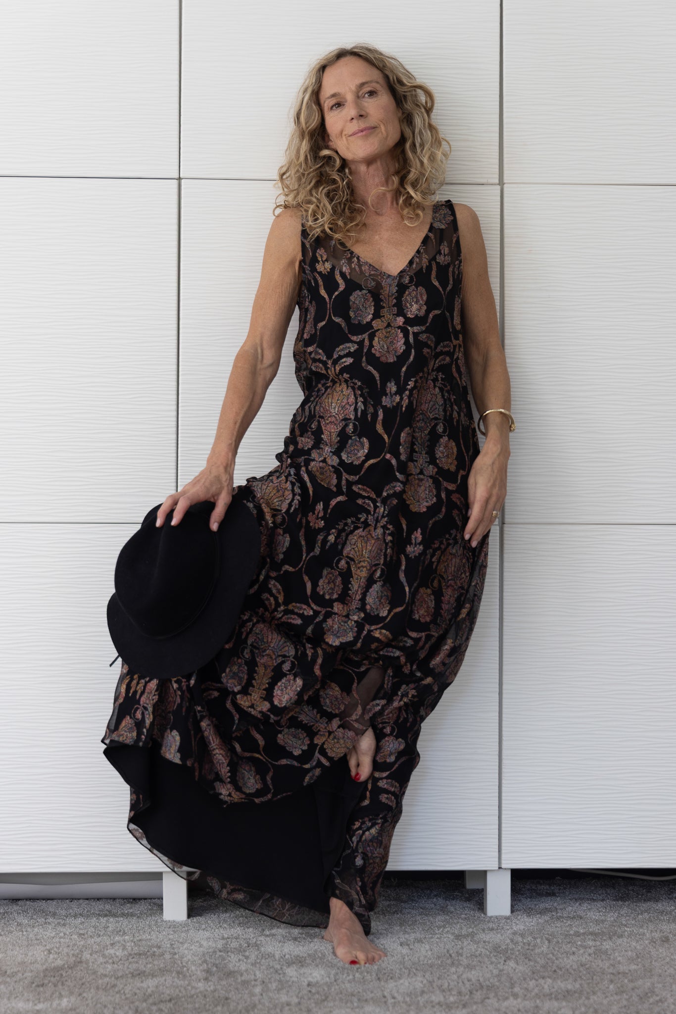Close-up of Soul Sway sheer black silk A-line slip dress over a black satin slip, highlighting the subtle lustre and sophisticated paisley-style copper-bronze design from Preema Aura’s Soul Series.