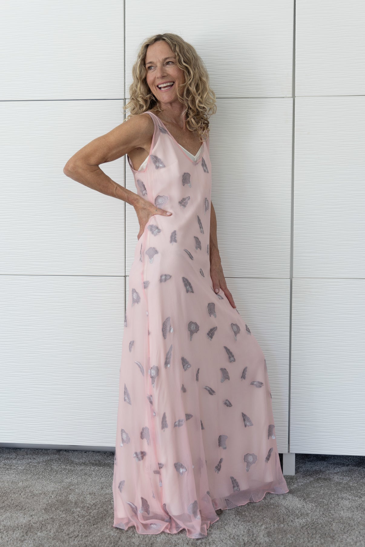 Soul Whisper French silk A-line slip dress in soft neutral tones, layered over a cream slip and photographed indoors in natural light to reveal its airy movement and subtle sheen.