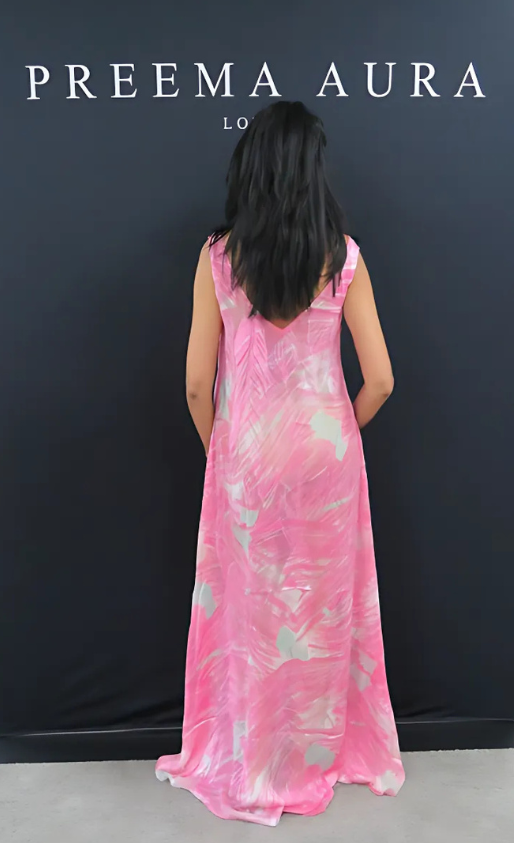 Model wearing Soul Wild silk maxi dress in pink abstract print, showcasing low V-back design – Preema Aura London.