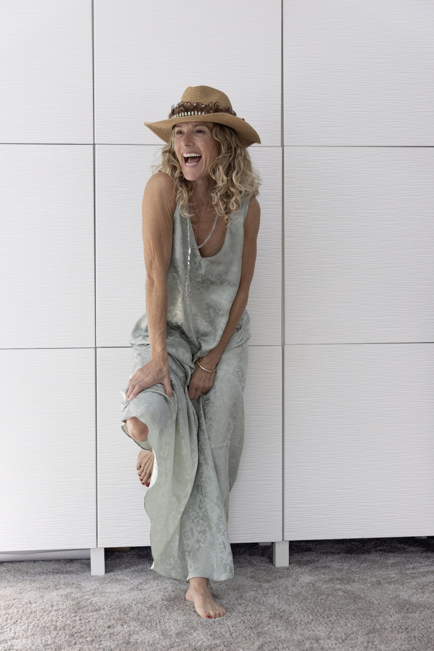 Model in the Preema Aura Soul Mist soft sage green silk maxi dress, showcasing its relaxed drape and luxurious craftsmanship from the Soul Series collection.